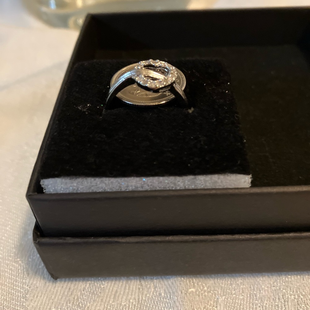 925 Stirling silver, open heart ring with CZ accent. size 7